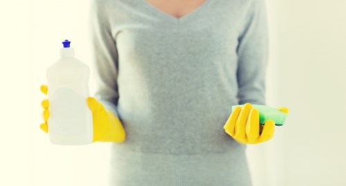 Technician performing stain treatment on carpet fibers